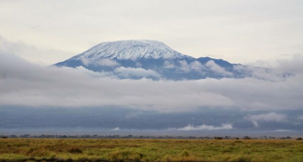 Mount Kilimanjaro above the clouds from Amboseli Kenya safari